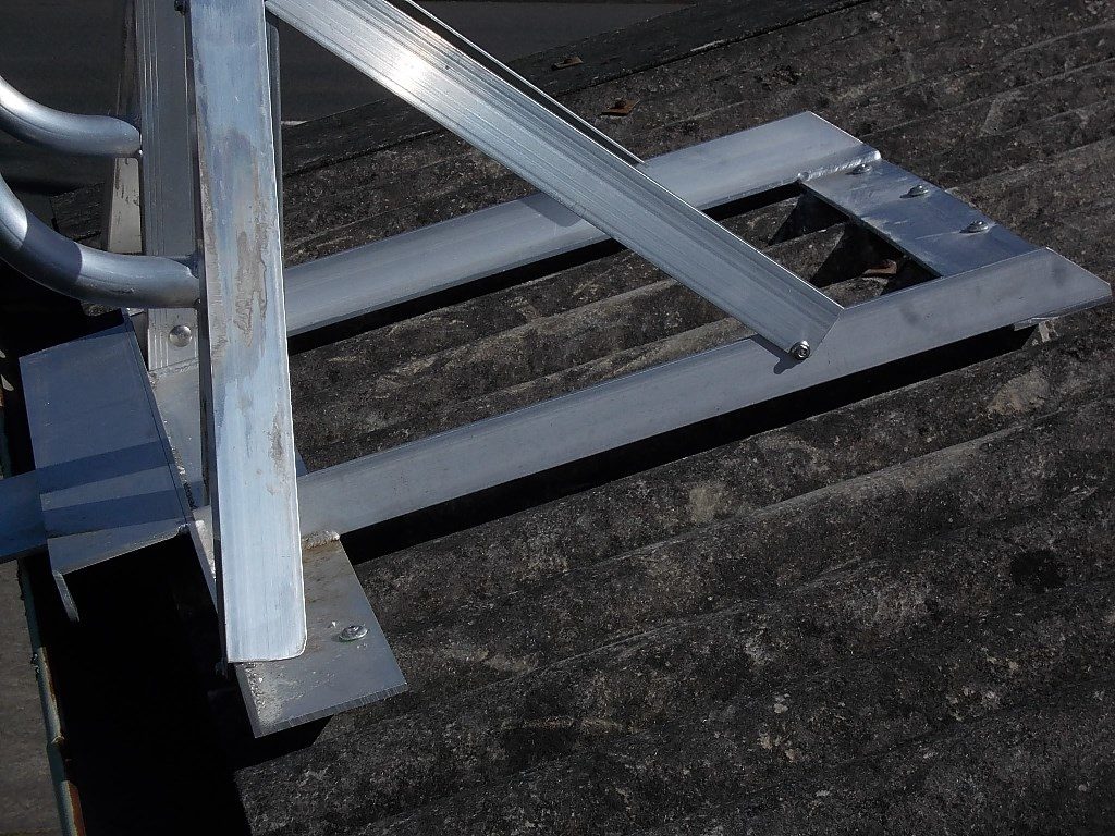 Dangerous ladder bracket installation on asbestos roof