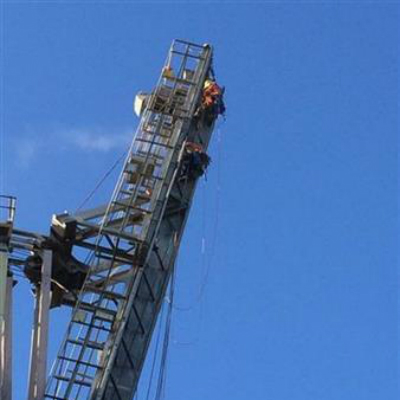 Rope access structural steel maintenance closeup