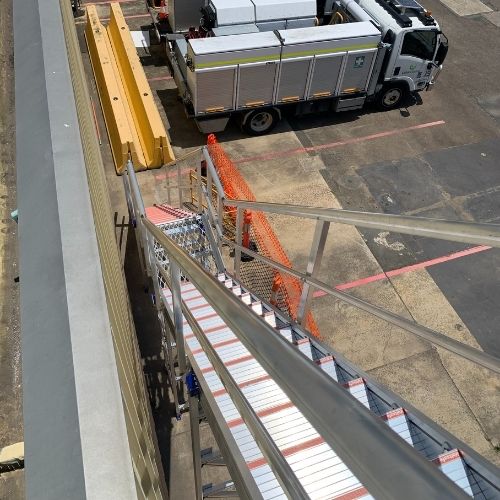 System hugs and scales the building 