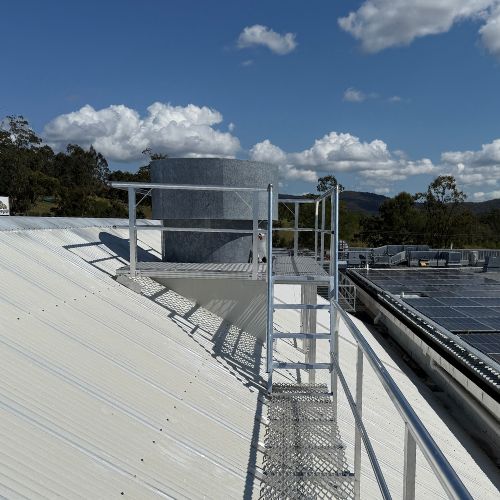 walkway and stairs to elevated roof plant platform